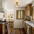 Load image into Gallery viewer, Mid-Century Brass Single Clear Glass Globe Ceiling Light
