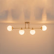 Load image into Gallery viewer, Farmhouze Light-Minimalist White Glass Globe Linear 4-Light Sputnik Semi Flush-Ceiling Light-Brass-
